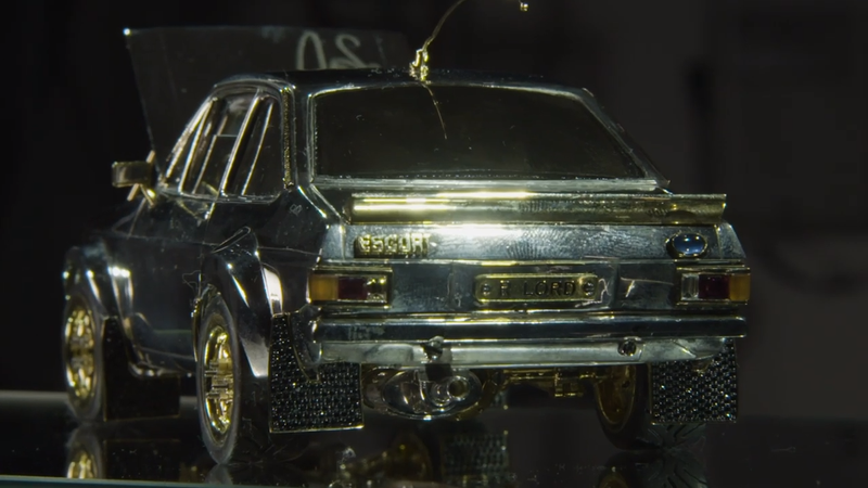 Illustration for article titled I Am So Here for This Tiny Ford Escort Model Made of $90,000 in Silver, Gold and Diamonds